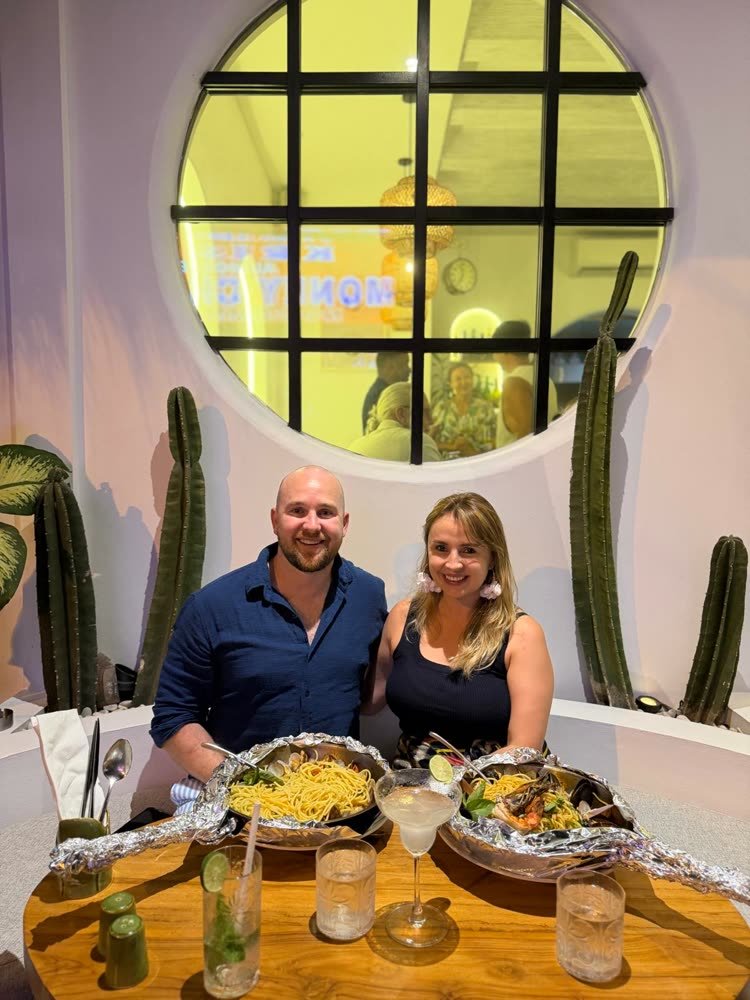 Two guests with pasta at the window table of Artista Cucina in Canggu