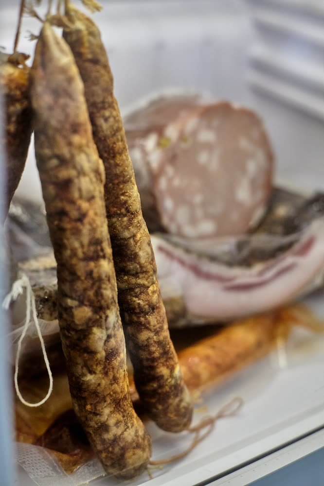 Prosciutto in the counter at Artista Cucina